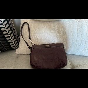 Small burgundy wristlet